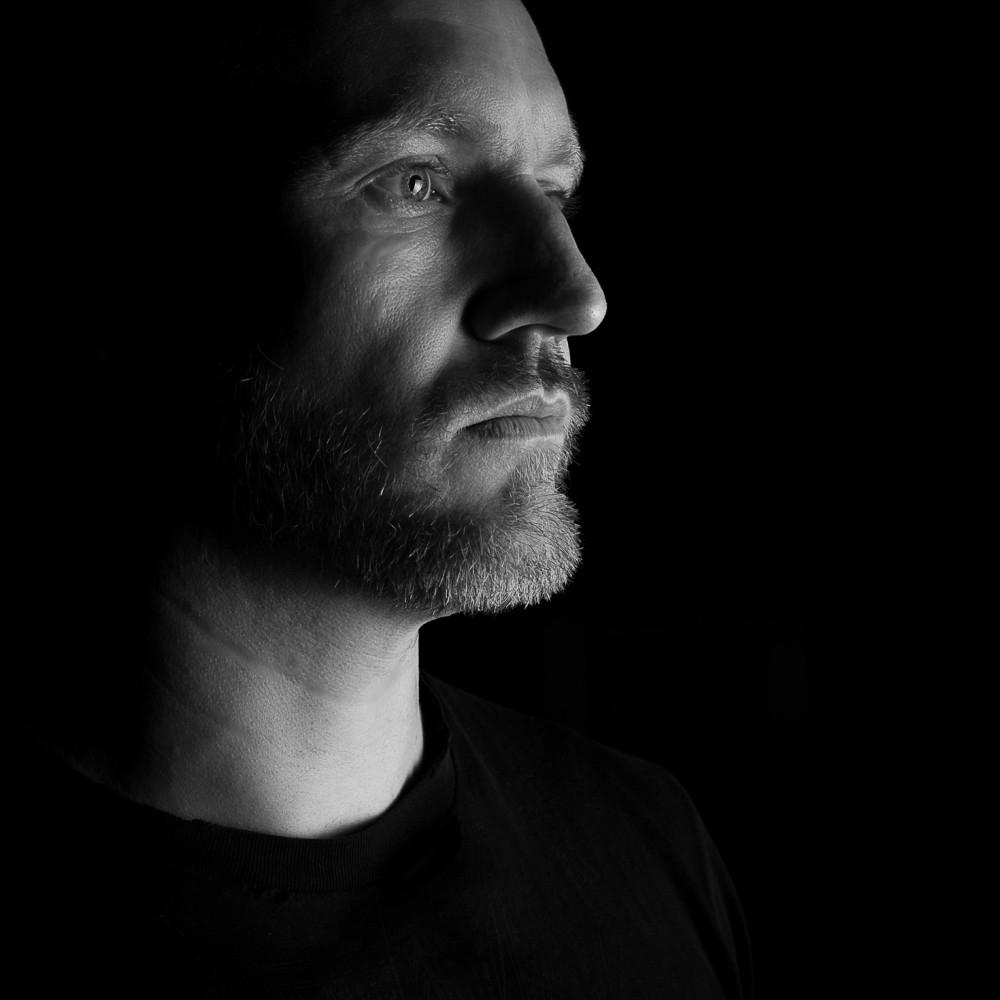Black-and-white portrait of Dan Kalma, music producer and photographer